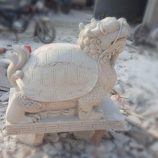 晚霞紅風水龍龜石雕是怎么制作出來的？